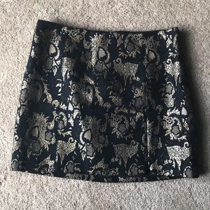 Bebe Gold and Black Printed Mini Skirt